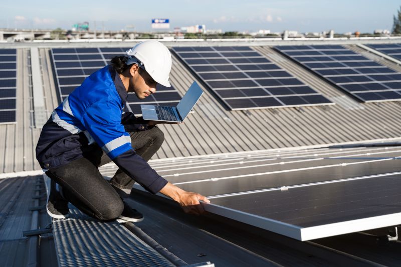 Professional solar technicians inspecting panels